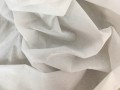 Biała flizelina z klejem